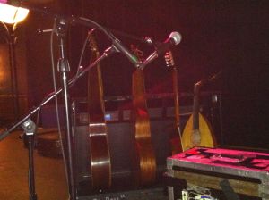 The Axe-Man cometh! David Lindley's instruments, including a massive baritone Hawaiian guitar, normal Hawaiian guitar, bouzouki and oud.