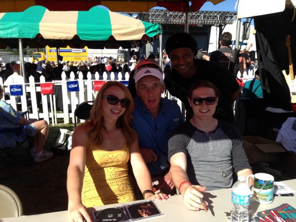Samantha and band suffer fools gladly in the merch tent after their set.